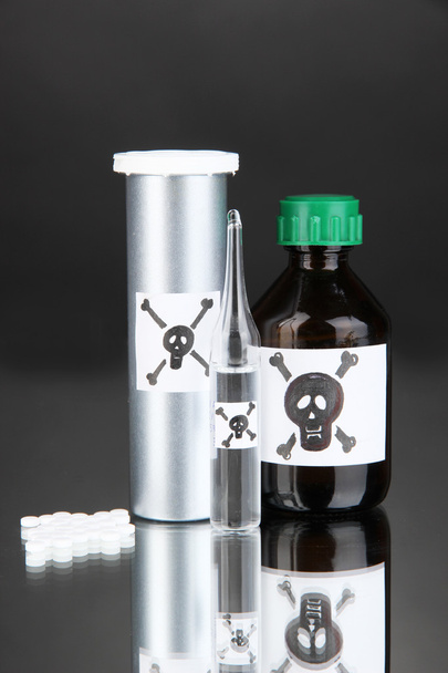 Deadly poison in bottles on black background - Foto, Imagem