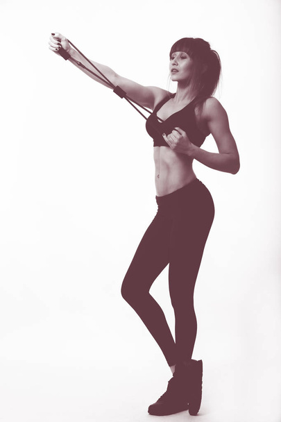 ejercicio de mujer con bandas elásticas para deportes
 - Foto, Imagen