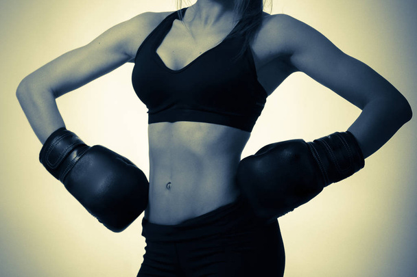girl in boxing gloves at the studio - Photo, Image