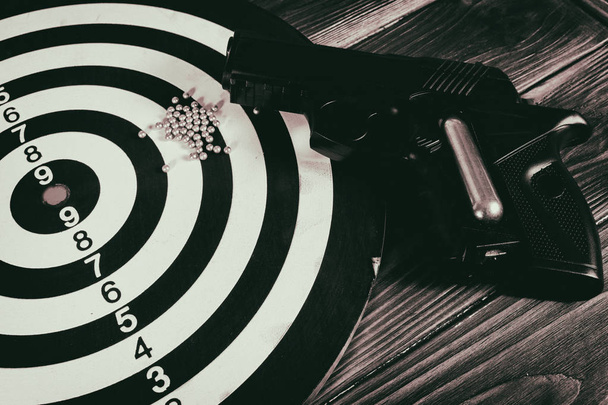 Air gun  and a target on the table - Photo, Image