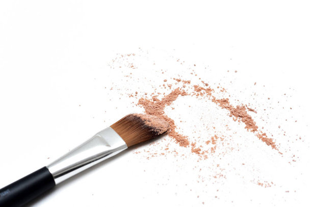 Make up brush with selection of colored make up powder  - Foto, imagen