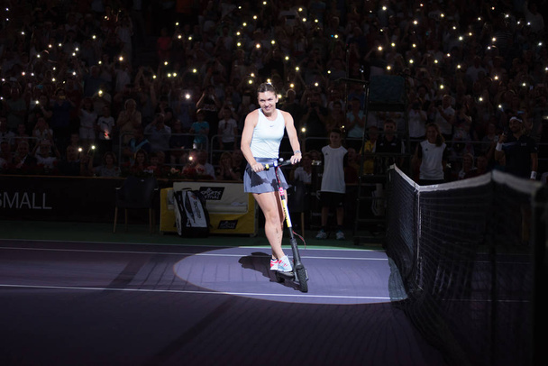 Tennis player legend Simona Halep on electric scooter - Valokuva, kuva