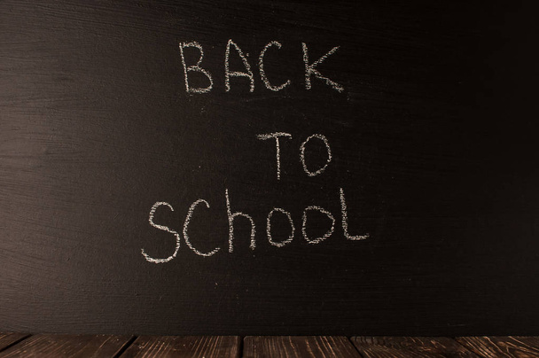 Back to school, the concept of parenting. The inscription on the blackboard with white chalk. Place for text. Copy space.  - Foto, Bild