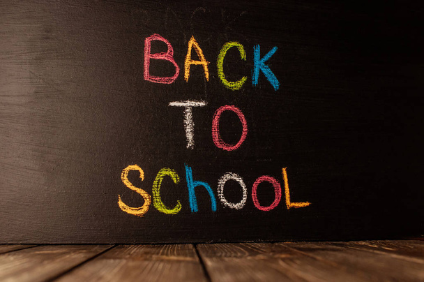  Back to school, the concept of parenting. The inscription on the blackboard colored chalk.  - Foto, imagen