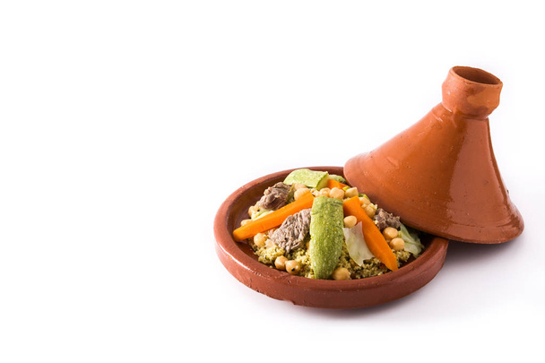 Traditional tajine with vegetables, chickpeas, meat and couscous isolated on white background. Copyspace - Photo, Image
