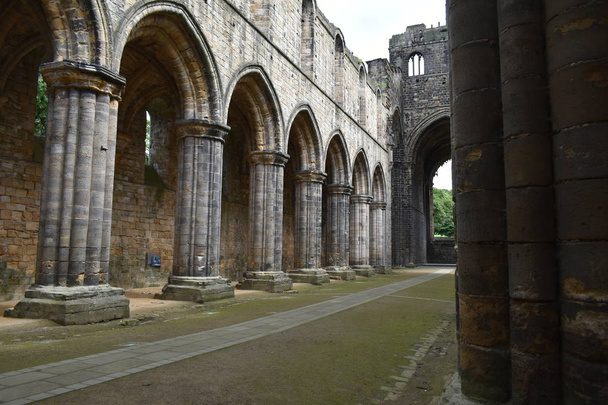 Kirkstall Abbey.A ruined Cistercian monastery,which is set in a public park.It was founded c.1152. - Photo, Image