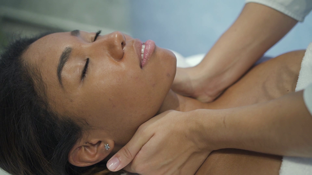 https://cdn.create.vista.com/api/media/small/277438278/stock-video-woman-enjoying-neck-massage-in-new-spa-salon?videoStaticPreview=true&token=