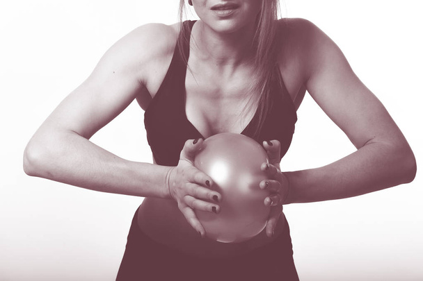 woman doing sports with a ball - Foto, Bild