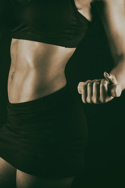 sexy fitness woman on black background - Фото, изображение