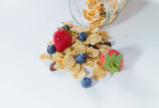 whole grain cereal flakes which mixed berry fruit and raisins - Photo, Image