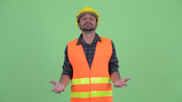 Heureux jeune homme barbu perse travailleur de la construction attraper quelque chose
 - Séquence, vidéo