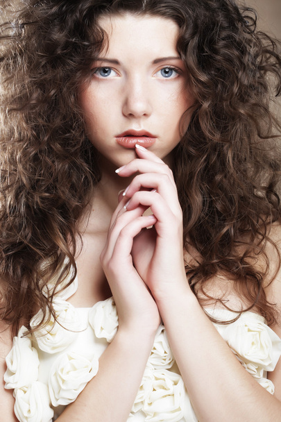 Image of beautiful young woman with curly hair - Photo, Image