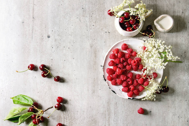 Fresh cherry and raspberry berries - Fotó, kép