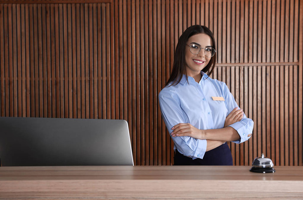 Portrait of receptionist at desk in lobby - Foto, immagini