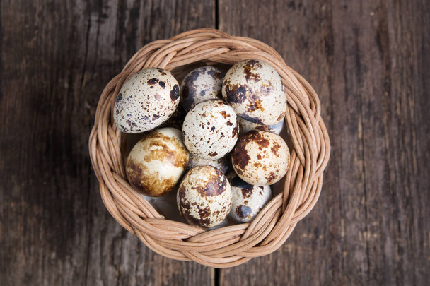Healthy diet food. Quail eggs in a basket. Top view - Foto, Imagen