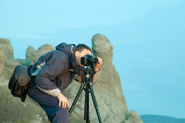 Photographer with camera on tripod - Photo, Image