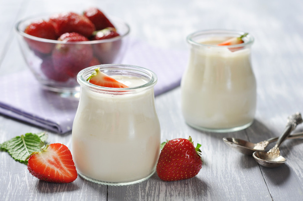 yogurt with ripe fresh strawberry - Фото, зображення
