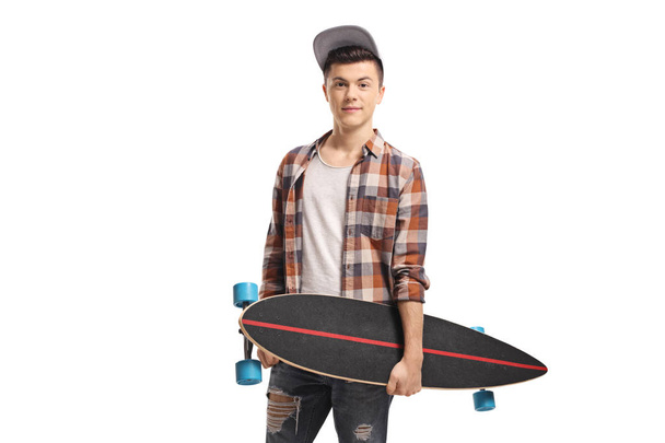 Young guy posing with a longboard - Фото, зображення