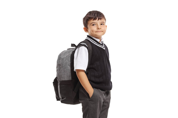 Schoolboy in a uniform with a backpack looking at the camera  - Photo, Image
