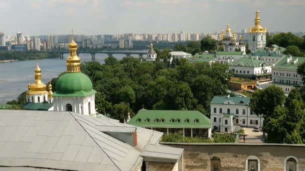 Orthodox Christian monastery. Golden domes of cathedrals and churches, Kiev-Pechersk Lavra Monastery, blue sky with clouds. Historic cultural sanctuary. Pechersk Lavra, Kiev, Ukraine. Static shooting.  - Footage, Video