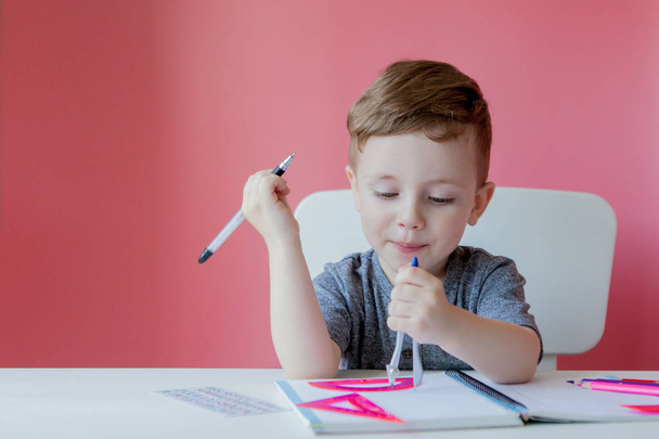 Portrait of cute kid boy at home making homework. Little concent - Fotoğraf, Görsel