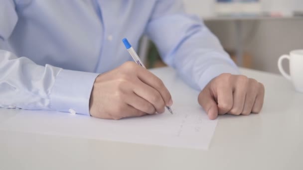 Close Up of Hand Writing at Work - Video
