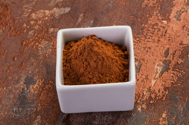 Cacao en polvo en el tazón
 - Foto, Imagen
