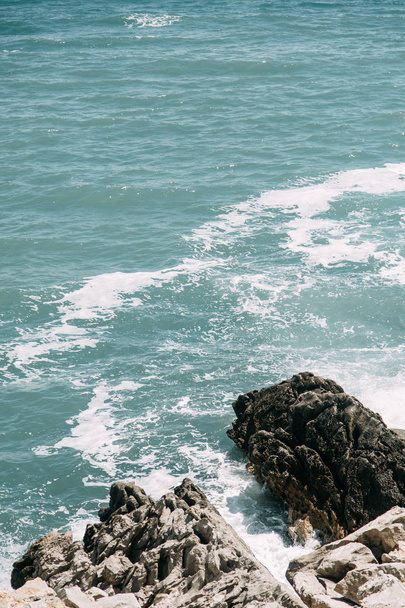  Blue abstract backgrounds and waves. Texture of sea water and rocky coast. - 写真・画像
