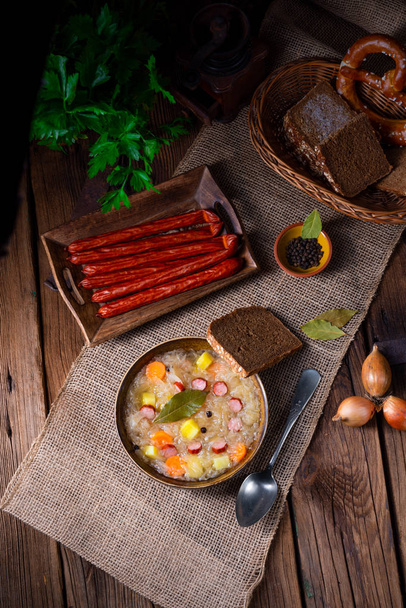 rustic sauerkraut soup with bacon and sausage - Fotoğraf, Görsel