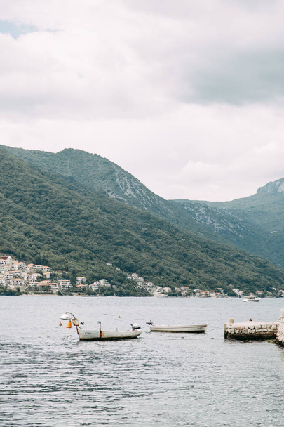  Streets and sights of the old town. Panorama of the city of Perast in Montenegro. - 写真・画像
