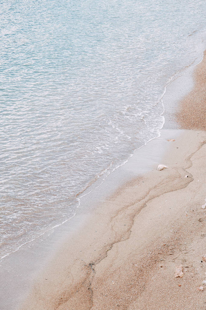 Minimalism of landscapes of Montenegro. Sandy beach and waves view from above.  - Фото, зображення