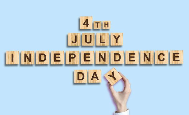 Independence Day. The inscription on the wooden blocks. Isolated. Independence Day United States of America background. Festive background. - Zdjęcie, obraz