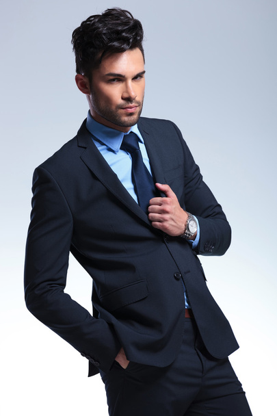 business man with hand on suit jacket - Zdjęcie, obraz