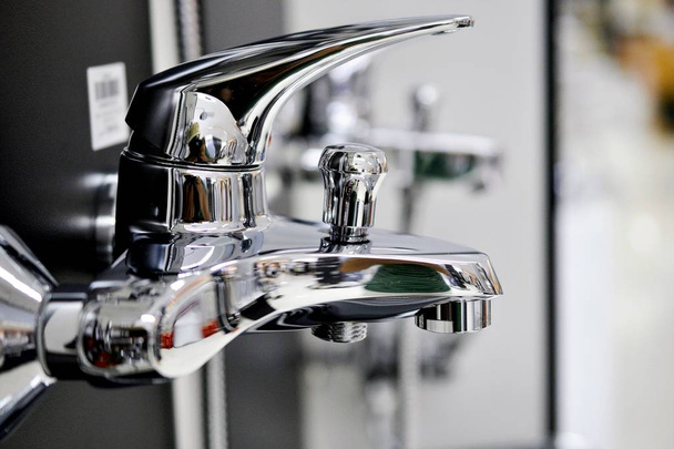 Water faucet, bathroom faucet and kitchen faucet. Chrome-plated metal. shallow dof.Pictured in a shop - Photo, Image