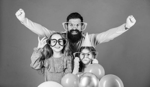 Lets celebrate. Family party. Family of father and daughters wearing party goggles. Father and girl children enjoying party time. Having a family celebration. Happy family celebrating birthday party - Φωτογραφία, εικόνα