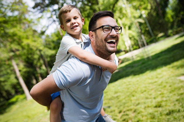 Happy father and his son spending time together and playing, smiling - Photo, image