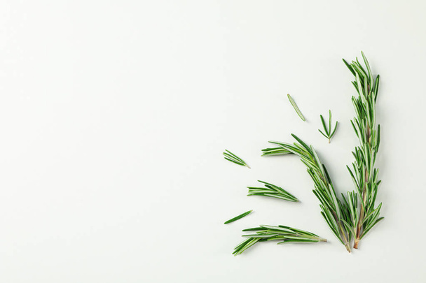 Flat lay composition with rosemary on white background, space fo - Foto, Bild