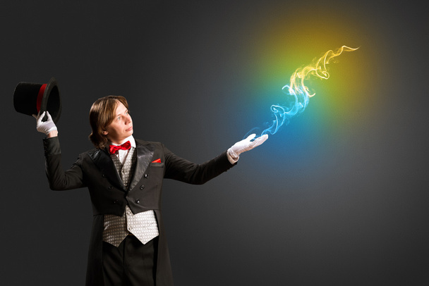 magician produces multicolored smoke - Photo, Image