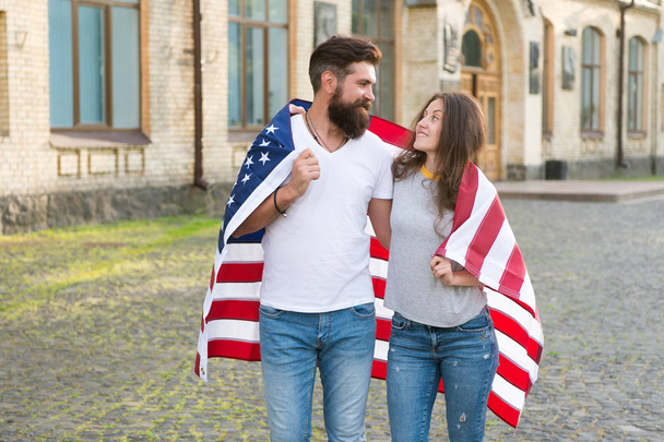 Visa applicants. Couple in love getting visa of united states. Bearded man and sensual woman wearing usa flag on independence day. Applying for visa to american citizenship. Visa or travel permit - Фото, зображення