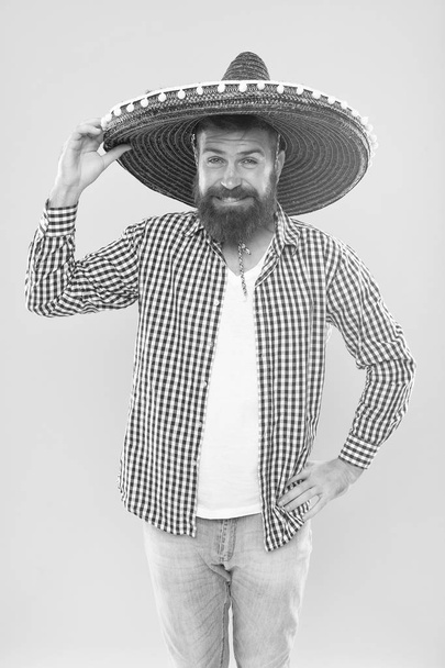 Great party hat. Traditional fashion accessory for mexican costume party. Bearded man in mexican hat. Hipster in wide brim hat. He is in love with mexican style. Mexican man wearing sombrero - Photo, image