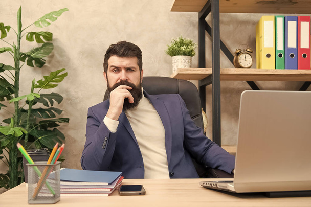 Concentration and focus. Man bearded boss sit office with laptop. Manager solving business problems. Businessman in charge of business solutions. Developing business strategy. Risky business - Fotografie, Obrázek
