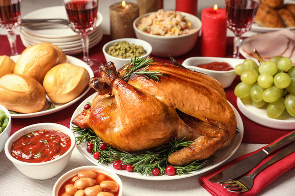 Traditional festive dinner with delicious roasted turkey served on table - Photo, Image
