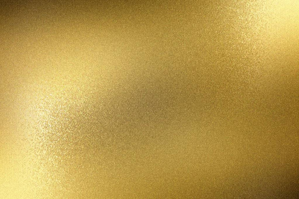 Light shining on rough gold metal panel, abstract texture background - Photo, Image