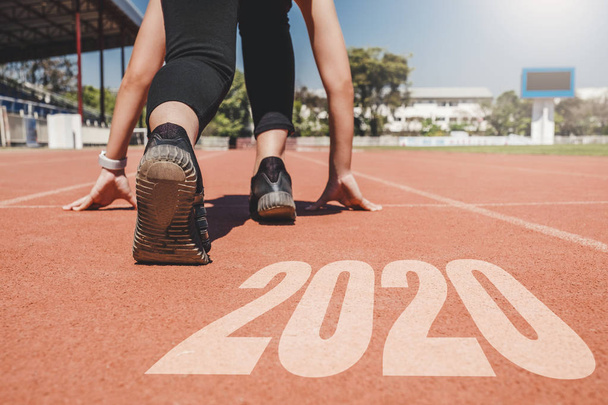 2020 Newyear , Athlete Woman starting on line for start running  - Valokuva, kuva