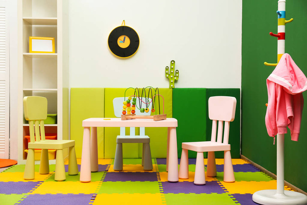 Stylish playroom interior with table and chairs - Φωτογραφία, εικόνα