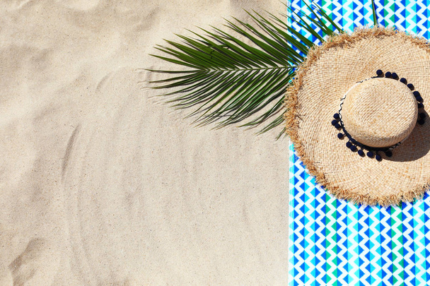 Flat lay composition with beach accessories on sand. Space for text - Photo, image