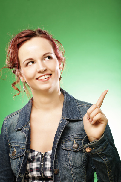 Young woman with her finger up over - Foto, afbeelding