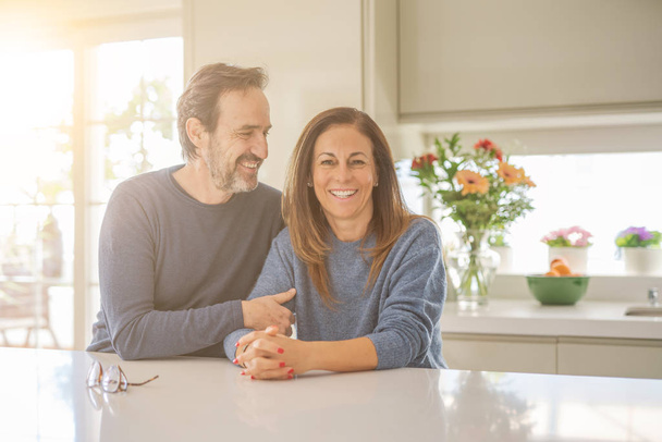 Romantic middle age couple sitting together at home - Photo, Image