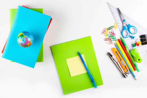 Back to school. Bright, multicolored stationery, textbooks and notebooks Mock up on a white background for school. Isolated, Flat Lay, Copy space, top view, space for text. - Photo, Image