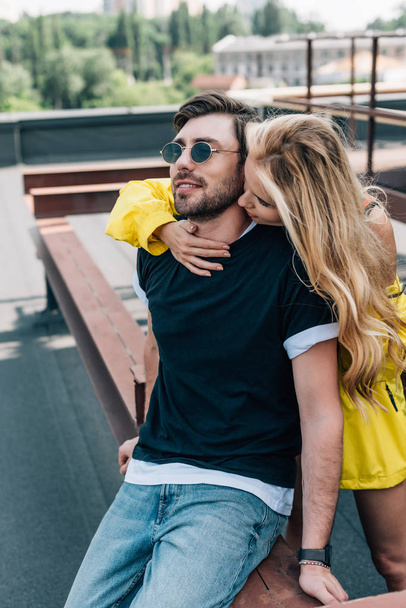 beautiful and blonde woman kissing and hugging handsome man  - Fotografie, Obrázek